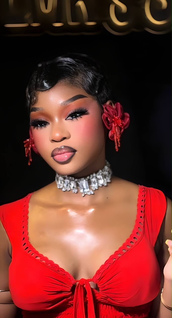 LMR Studio client wearing a sleek short hairstyle and luminous red-toned glam makeup